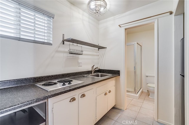 kitchen with white cabinetry, sink, beverage cooler, white electric cooktop, and light tile patterned floors