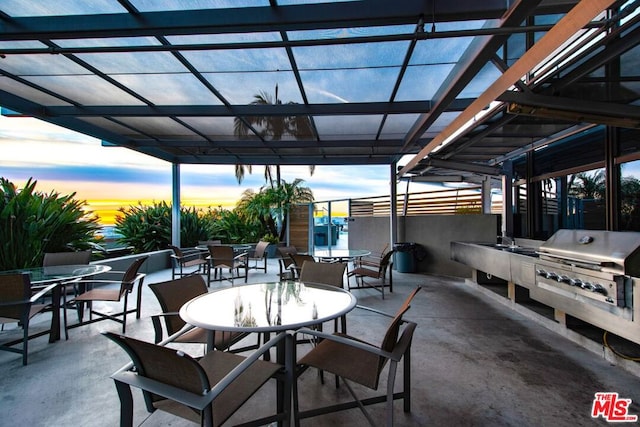 patio terrace at dusk with area for grilling