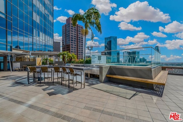 view of terrace featuring a bar