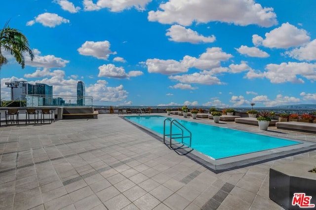 view of pool featuring a patio area