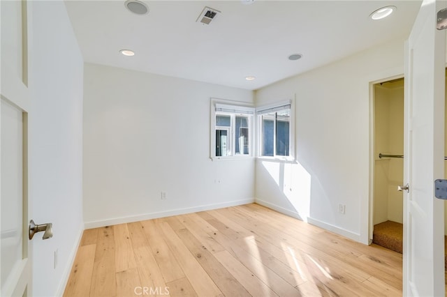 unfurnished bedroom featuring light wood-type flooring