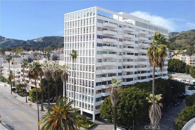 view of building exterior with a mountain view