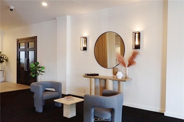 living area featuring recessed lighting and baseboards