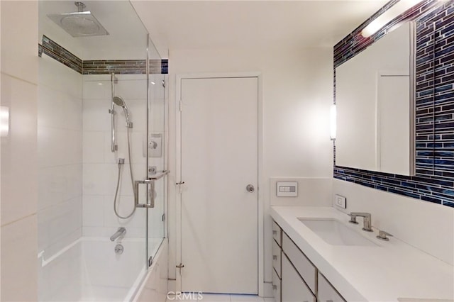 full bath with bath / shower combo with glass door, backsplash, and vanity