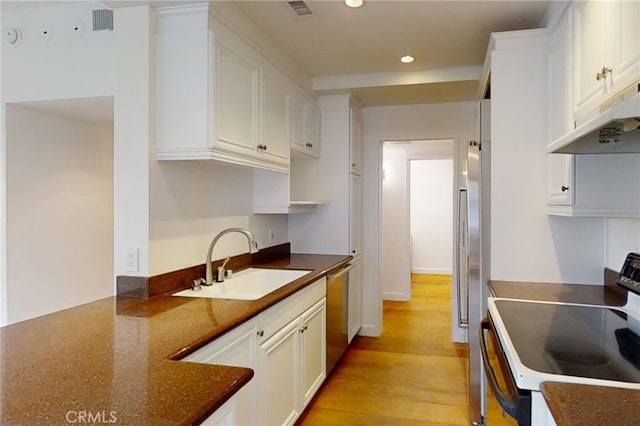 kitchen featuring electric range, stainless steel dishwasher, white cabinetry, a sink, and under cabinet range hood