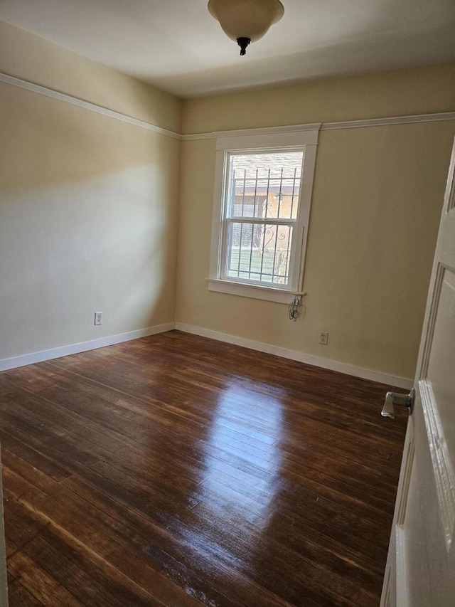 unfurnished room featuring dark hardwood / wood-style floors