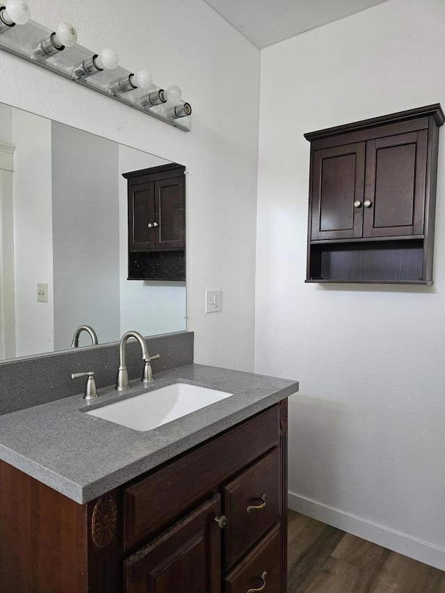 bathroom featuring vanity and wood-type flooring