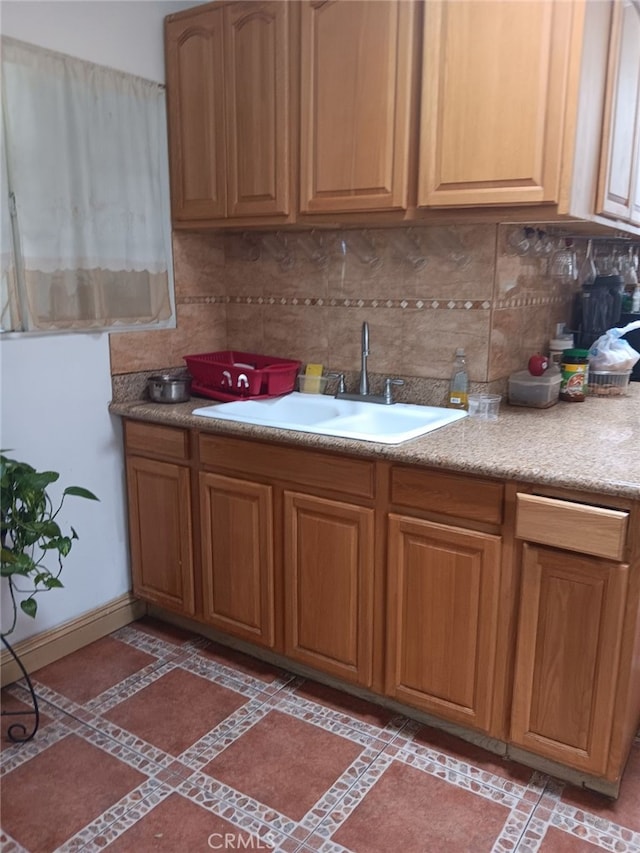 kitchen with tasteful backsplash and sink