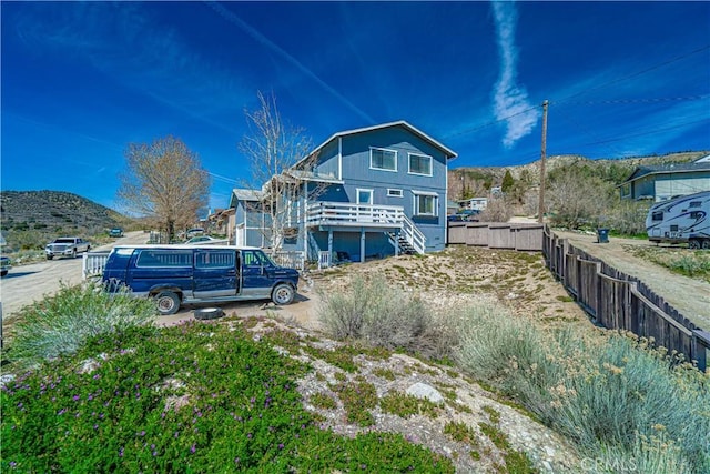 back of property featuring a mountain view