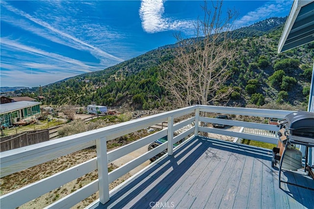 wooden deck featuring a mountain view