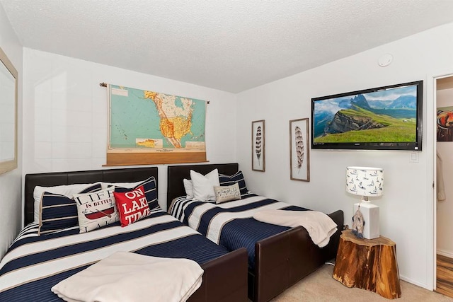 carpeted bedroom with a textured ceiling