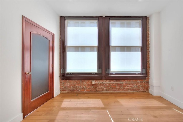 spare room with light hardwood / wood-style flooring