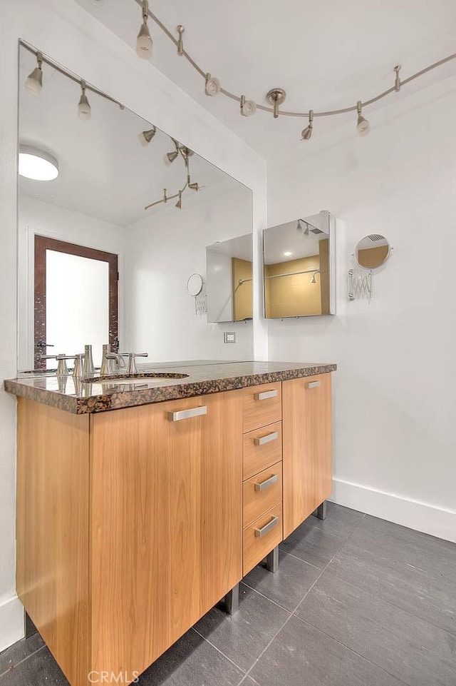 bathroom with tile patterned floors and vanity