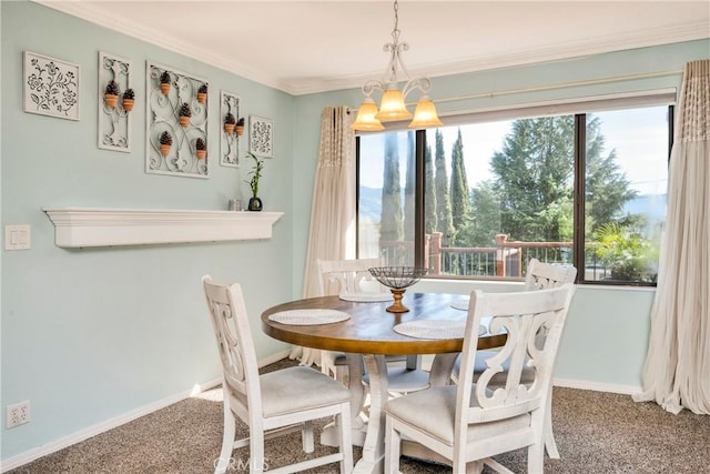 carpeted dining space featuring crown molding, baseboards, and an inviting chandelier