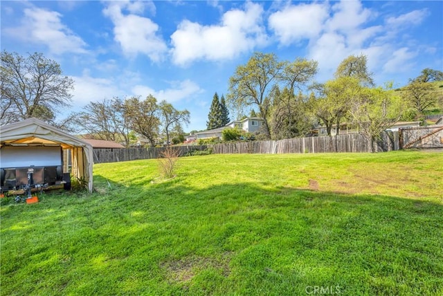view of yard featuring a gazebo and a fenced backyard