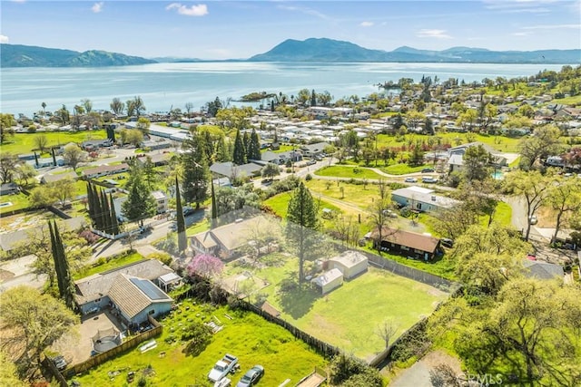 birds eye view of property featuring a residential view and a water and mountain view