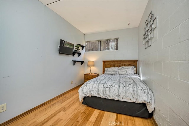 bedroom with wood finished floors