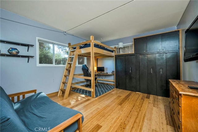bedroom featuring light wood-type flooring