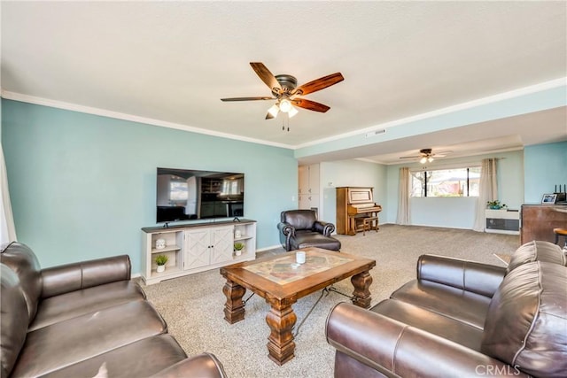 carpeted living room featuring visible vents, a ceiling fan, baseboards, and crown molding