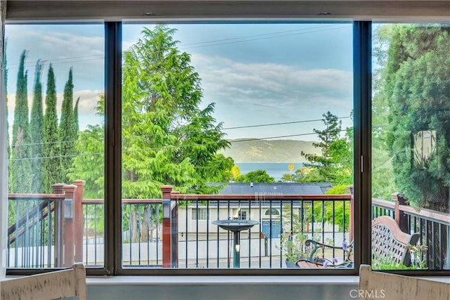 doorway to outside featuring a water view