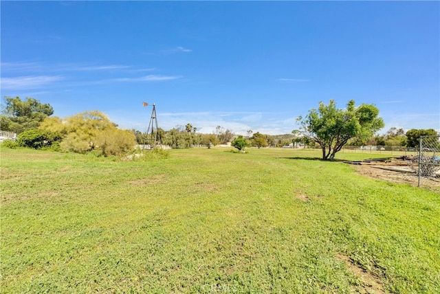 view of yard with a rural view