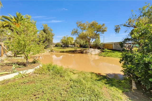 surrounding community with a water view