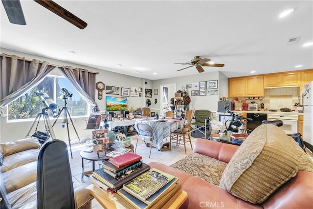 living room featuring ceiling fan and light tile patterned floors