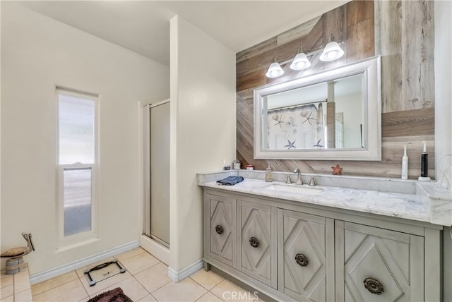 bathroom featuring vanity, tile patterned floors, and a shower with door