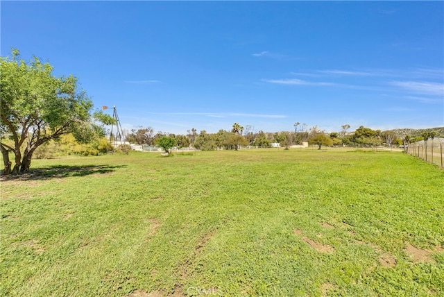 view of yard with a rural view