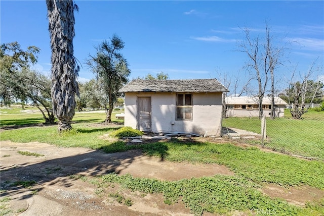 view of outdoor structure with a lawn