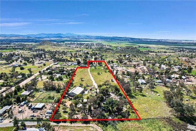 birds eye view of property with a mountain view