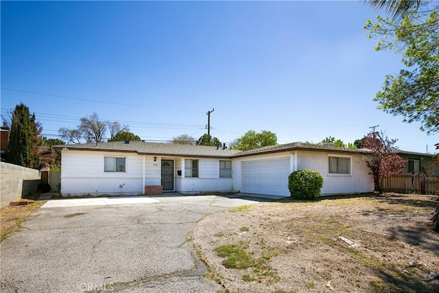 ranch-style home featuring a garage