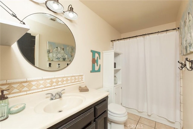 full bathroom with toilet, vanity, tile patterned flooring, and shower / tub combo with curtain