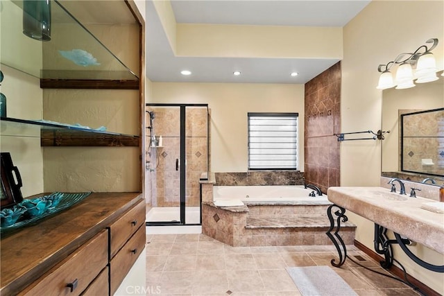 bathroom with tile patterned flooring and separate shower and tub