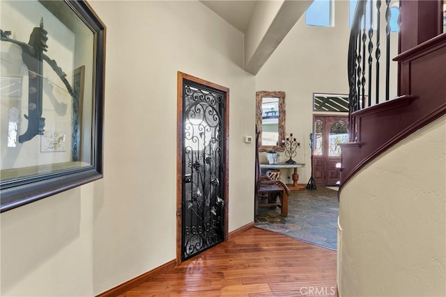 foyer entrance with hardwood / wood-style floors