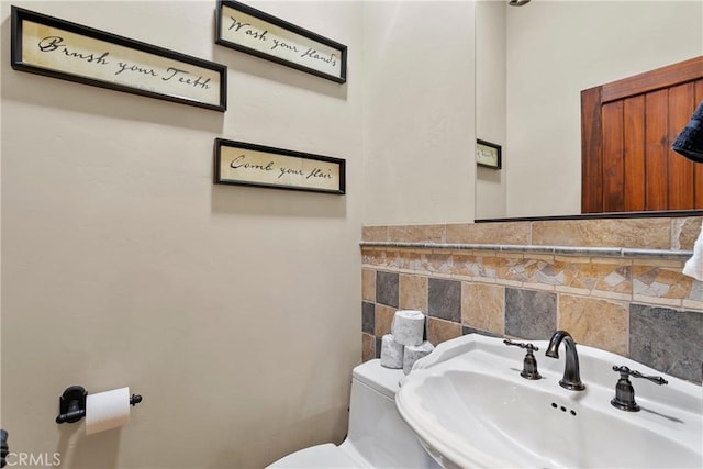 bathroom with sink and toilet