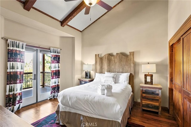 bedroom with dark wood-type flooring, ceiling fan, vaulted ceiling with beams, and access to outside