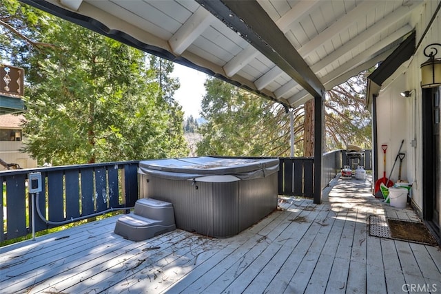 deck with a hot tub