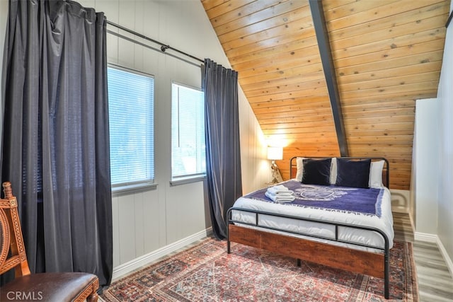 bedroom featuring hardwood / wood-style floors, wood ceiling, and vaulted ceiling