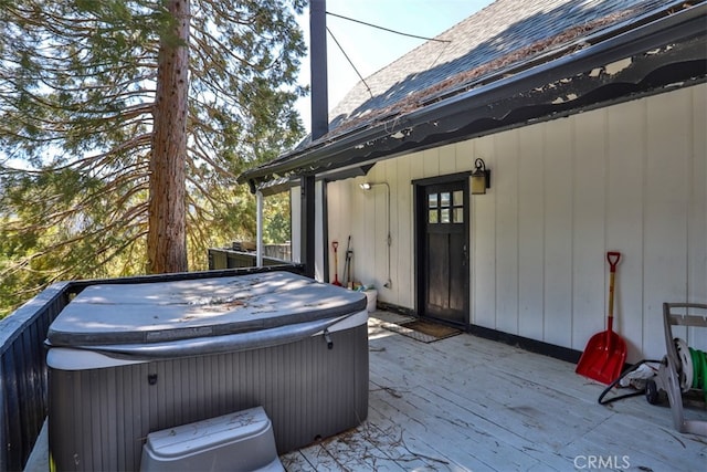 view of patio / terrace with a wooden deck and a hot tub