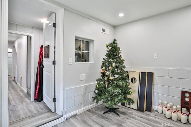 hall with light hardwood / wood-style floors