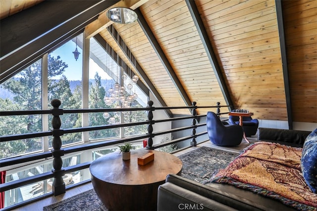 interior space with hardwood / wood-style floors, beamed ceiling, and wooden ceiling