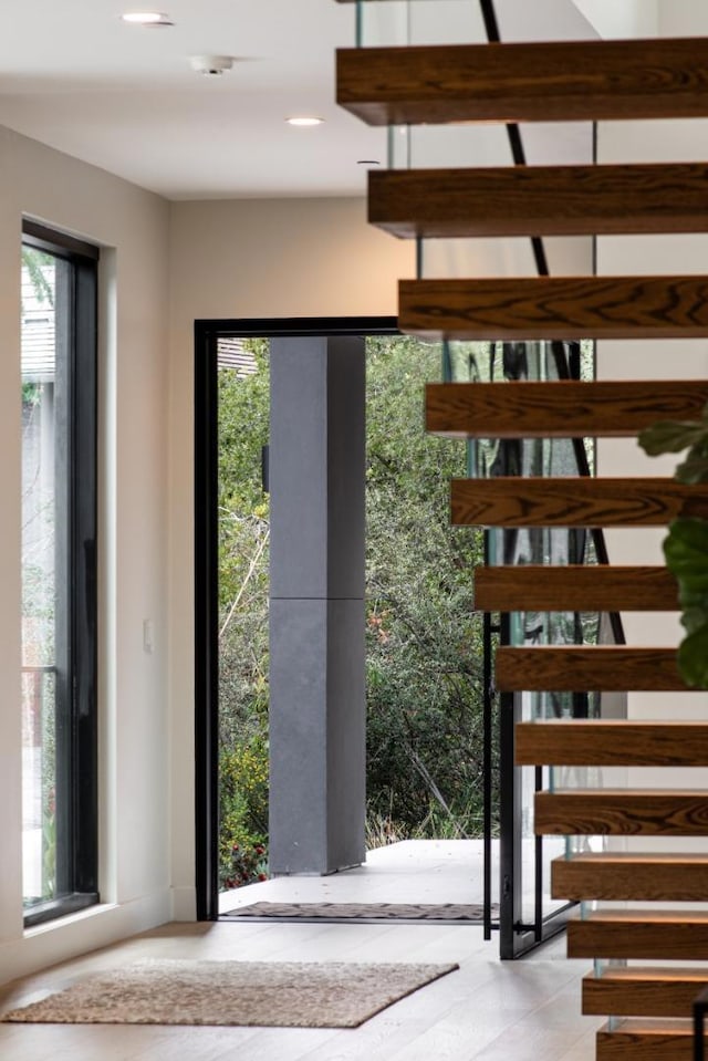 stairs featuring plenty of natural light