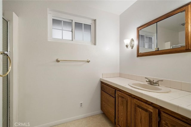 bathroom with vanity and tile patterned flooring