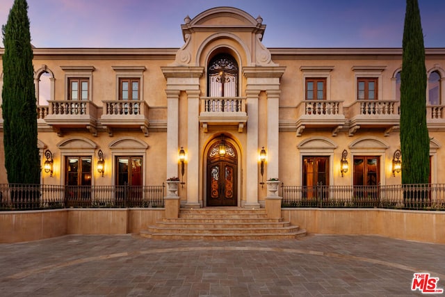 view of front of home with a balcony