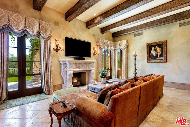 living room with french doors, a high end fireplace, and beam ceiling