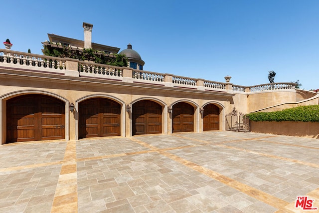 mediterranean / spanish-style house featuring a garage