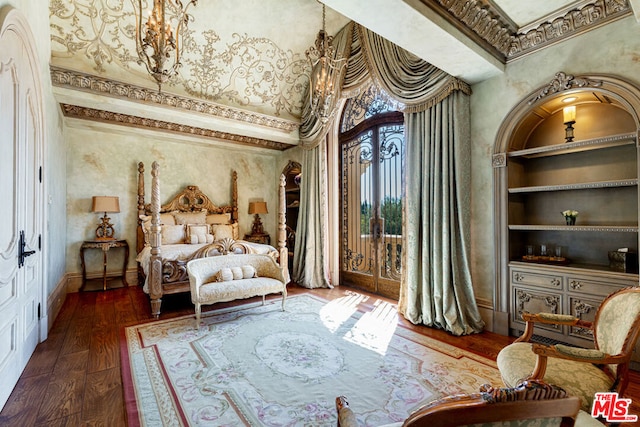 sitting room with built in features, a high ceiling, and dark hardwood / wood-style flooring