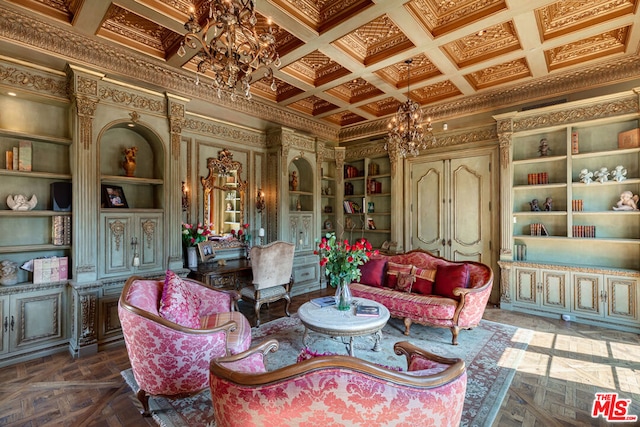 living area with coffered ceiling, dark parquet flooring, crown molding, built in features, and a chandelier