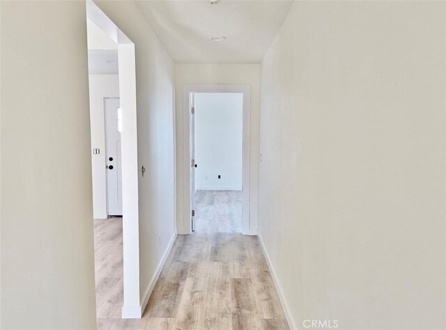 corridor featuring light hardwood / wood-style flooring